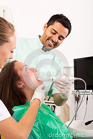 Dentist examines the oral cavity Stock Photo