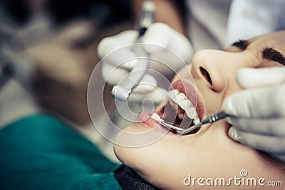 The dentist examines the patient`s teeth Stock Photo