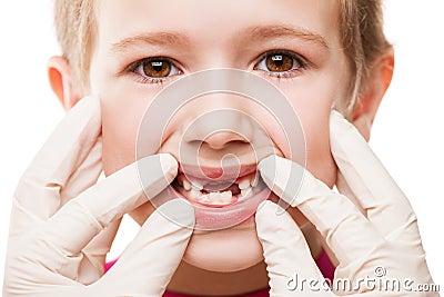 Dentist examining child teeth Stock Photo