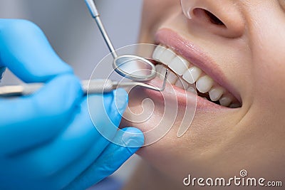 Dentist examining a patient's teeth in the dentist Stock Photo