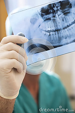 Dentist Examining X-Ray Stock Photo