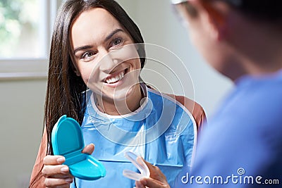 Dentist Giving Woman Advice On Cosmetic Teeth Whitening Stock Photo