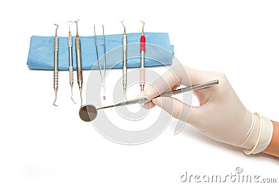 Dentist hand and dental tool Stock Photo