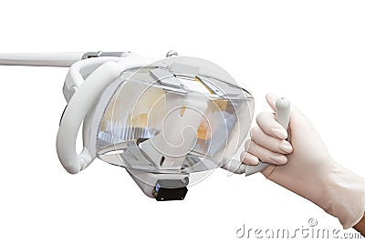 Dentist hand holding Lamp in a dentist's clinic Stock Photo