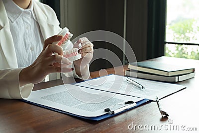 The dentist has shown the use of dental tools with samples tooth model in the clinic. Orthodontic dental professional Stock Photo
