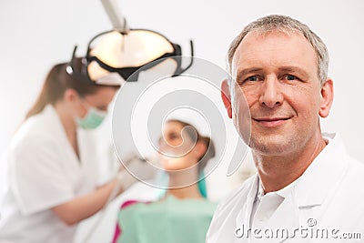 Dentist in his surgery Stock Photo