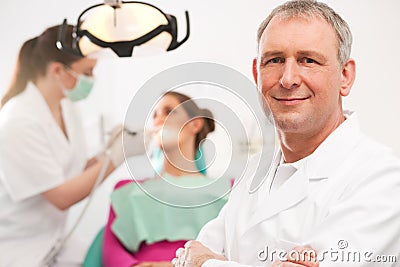 Dentist in his surgery Stock Photo