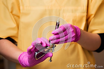 Dentist hold syringe with anesthetic Stock Photo