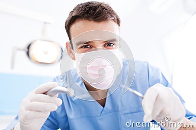 Dentist Holding Dental Tools Stock Photo