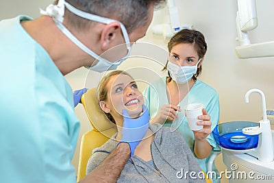 Dentist inspecting teeth Stock Photo