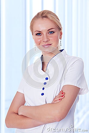 Dentist lady standing with folded hand Stock Photo