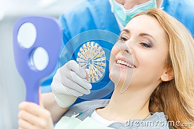 Dentist matching teeth colour with palette Stock Photo