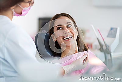 Dentist and patient in dentist office Stock Photo