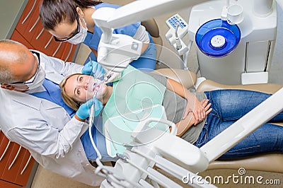 At the dentist patient lying dental chair Stock Photo