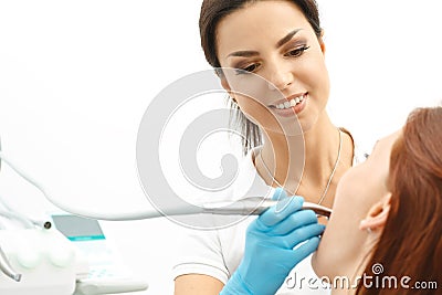 Dentist performing a dental procedure on patient Stock Photo