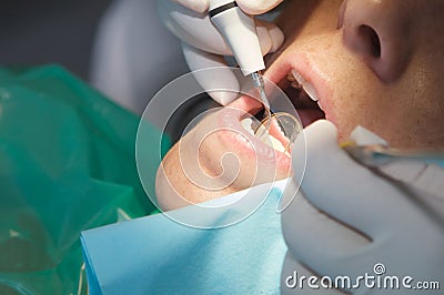 Dentist performing a scan on his patient Stock Photo