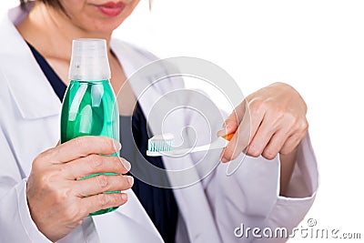 Dentist recommends soft slim tapered bristle toothbrush, toothpaste, and mouthwash Stock Photo