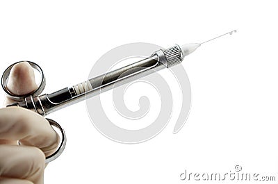 Dentist`s hand with carpool syringe for local anesthesia Stock Photo