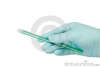 Dentist`s hand in glove with a saliva ejector Stock Photo