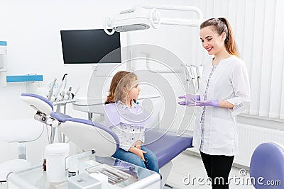 Dentist and small girl in cabinet Stock Photo