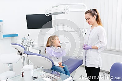 Dentist and small girl in cabinet Stock Photo