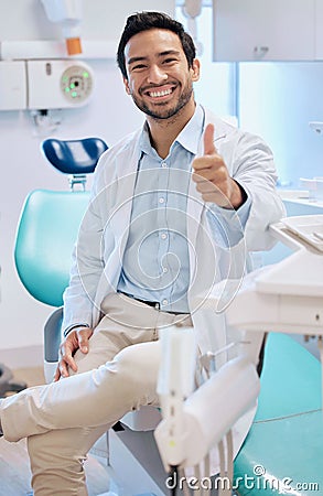 Dentist, thumbs up and portrait of man in office for teeth whitening, service and dental care. Healthcare, dentistry and Stock Photo