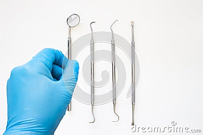 A dentist about to starts examining a patient. Professional Dental Hygiene cleaning tools. Calculus and Plaque Remover Set, Dental Stock Photo