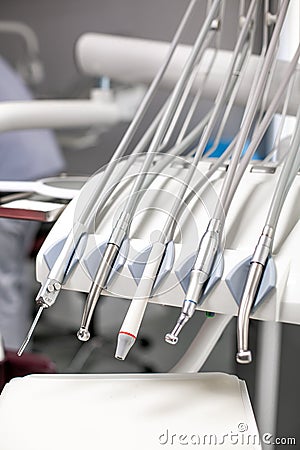 dentist tools and burnishers on a dentist chair in Dentist Clinic. Different dental instruments and tools Stock Photo
