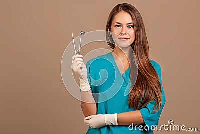 Dentist with tools. Concept of dentistry, whitening, oral hygiene, teeth cleaning with toothbrush, floss. Dentistry Stock Photo