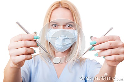 Dentist woman showing dental tools Stock Photo