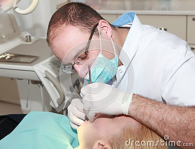 Dentist at work in dental room Stock Photo
