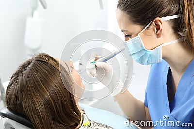 Dentist working with a patient Stock Photo