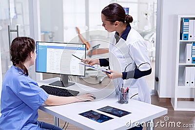Dentistiry practitioer and nurse looking at patients appointments Stock Photo