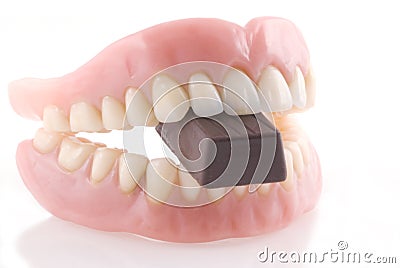 Dentures and chocolat. Stock Photo