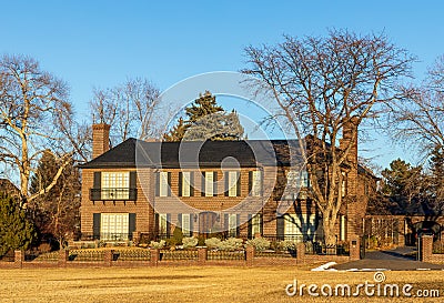 Old home with beautiful landscaping near Cranmer Park in Denver, Colorado Editorial Stock Photo