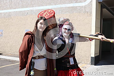 Denver, Colorado, USA - July 1, 2017: Jedi knight and Harley Quinn at Denver Comic Con Editorial Stock Photo