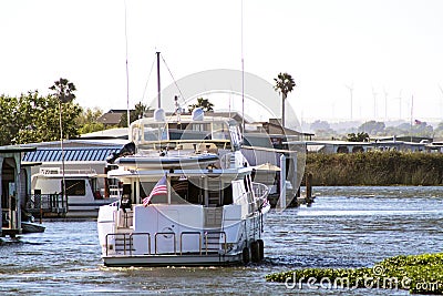 Departing Motor Yacht Stock Photo