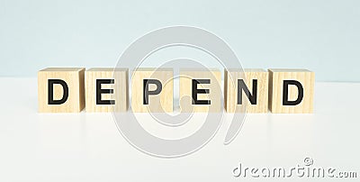 DEPEND word on blocks on a light Stock Photo