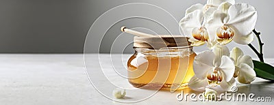 Banner. Sugar paste or wax honey for hair removing with white orchid flowers flows on white background. Copy space Stock Photo