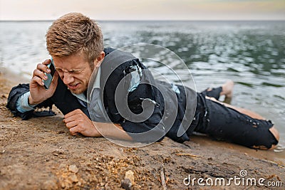 Depressed businessman trying to call, lost island Stock Photo