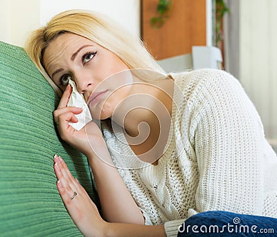 Depressed female sitting in silence Stock Photo
