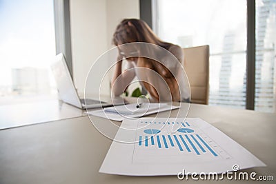 Depressed frustrated businesswoman shocked by company bankruptcy Stock Photo