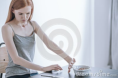 Depressed girl with eating disorder Stock Photo