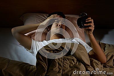 Depressed man suffering from insomnia Stock Photo