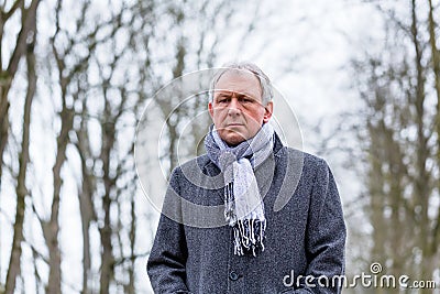 Depressed or sad man walking in winter Stock Photo