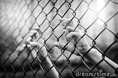 Depressed, trouble and lives matter. Black&White filter, women hand on chain-link fence Stock Photo