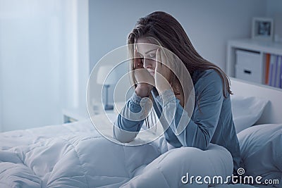 Depressed woman awake in the night Stock Photo