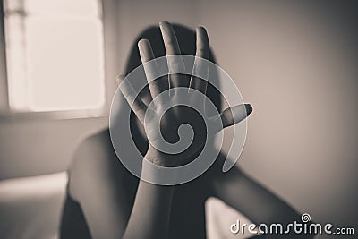 Depressed woman,Hand stop harassment sexual abuse,Black and white toned Stock Photo