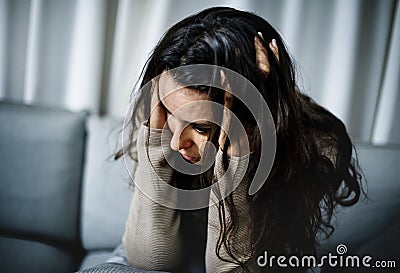 Depressed woman having a counseling session Stock Photo