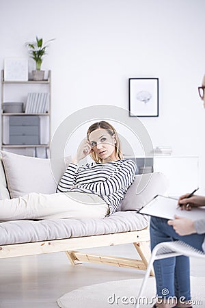 Depressed woman during psychotherapy Stock Photo